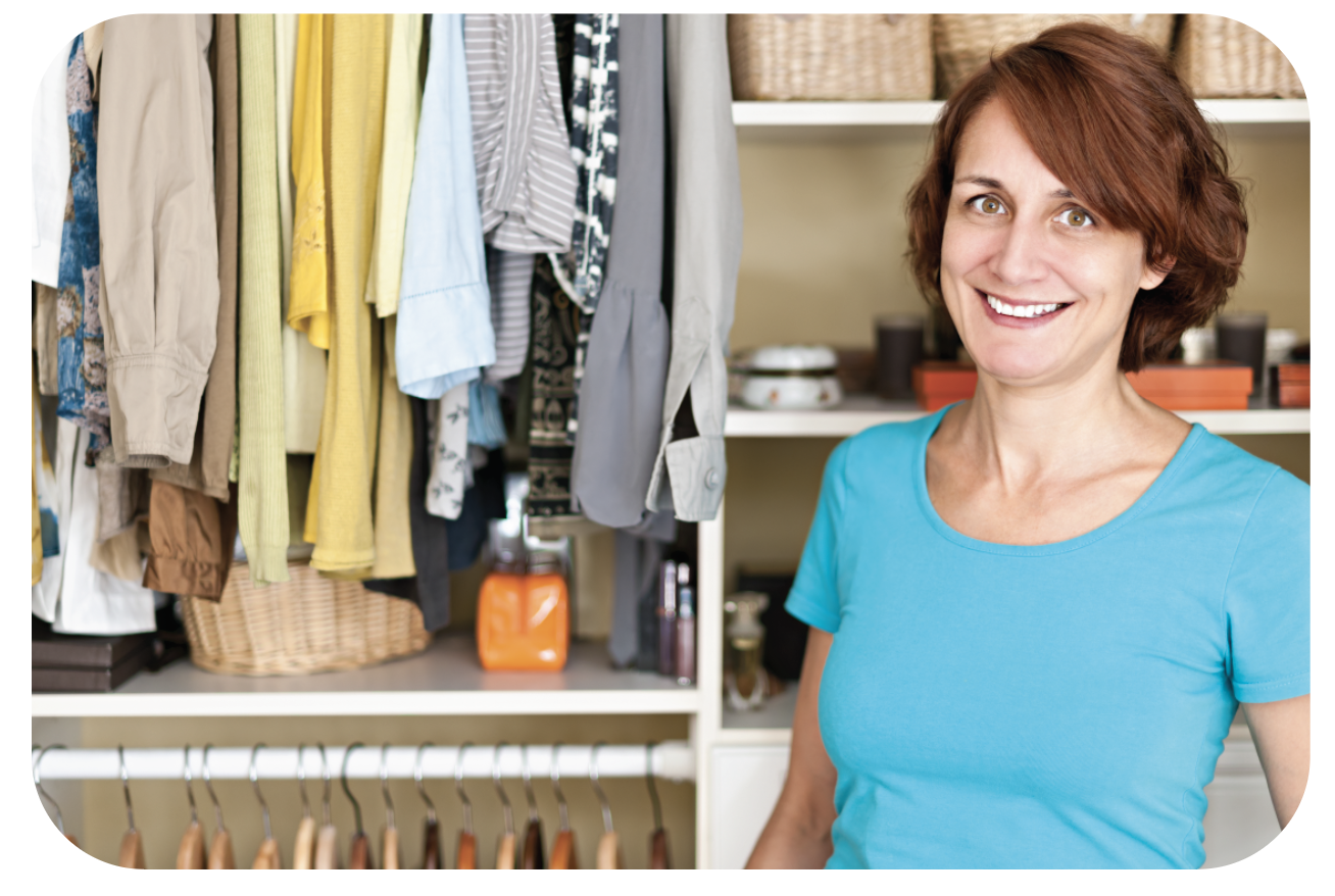 Smiling woman near neat closet